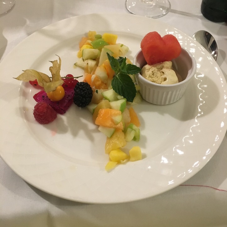 Fruit salad with vanilla ice-cream